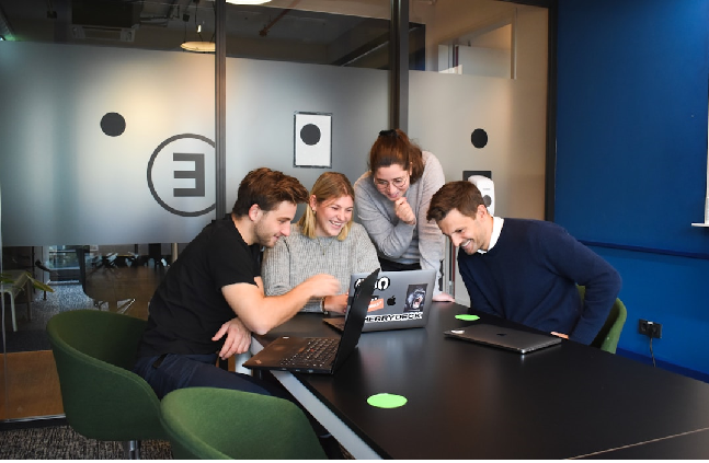  Professionals collaborating on RFP documents to streamline procurement and vendor selection.